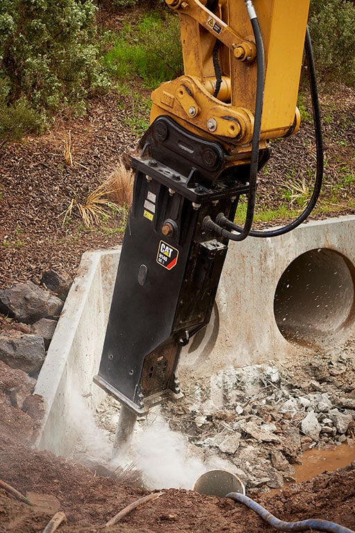 Cat GCS Hammer Close Up Working In a Culvert